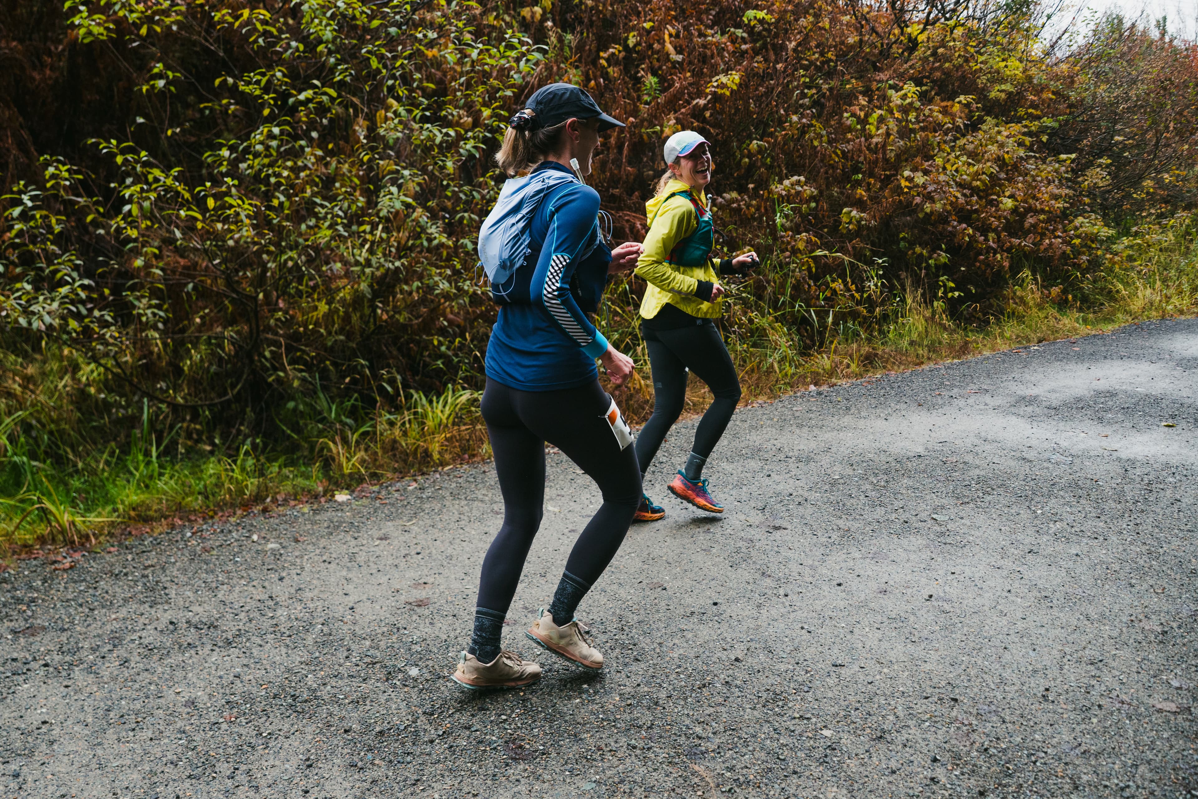Two Hyak Passage runners moving together on the gravel trail
